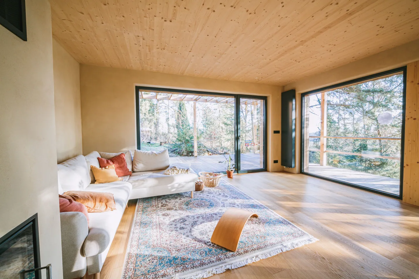 Sunlit living room with large residential windows