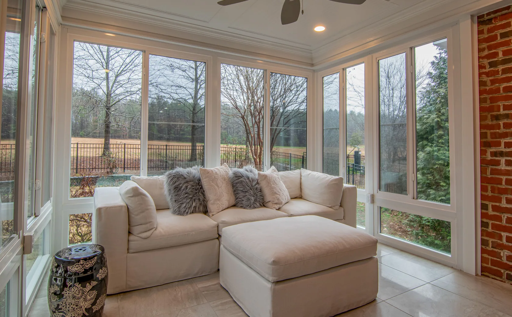 Bright residential room surrounded by finished replacement windows